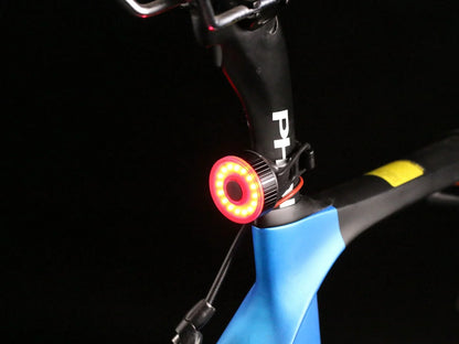 Bike frame with mounted red LED tail light, night visibility, bicycle safety accessory